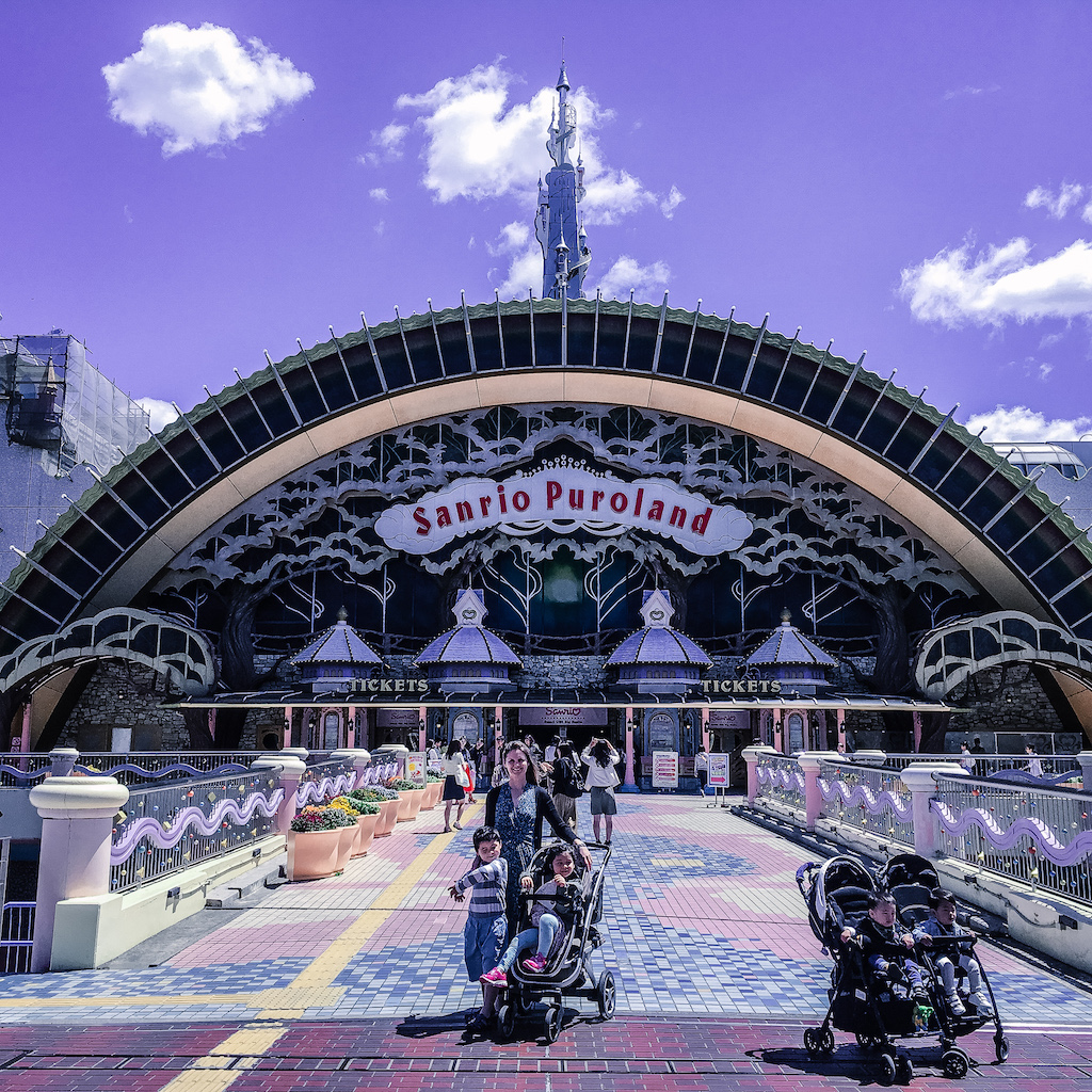 Sanrio Puroland Japan entrance with a stroller and kids